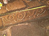 chalk marking carved stone pattern